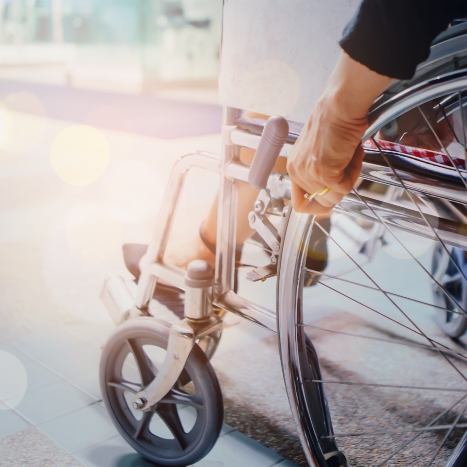 Close up of woman who use a wheelchair at the hospital with copy space