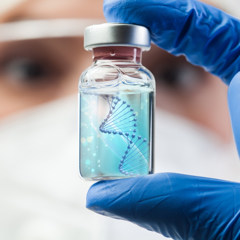 UK lab scientist biotechnologist holding glass ampoule phial with DNA strand,molecule of two polynucleotide chains forming double helix carrying Coronavirus genetic instruction,new strain RNA mutation