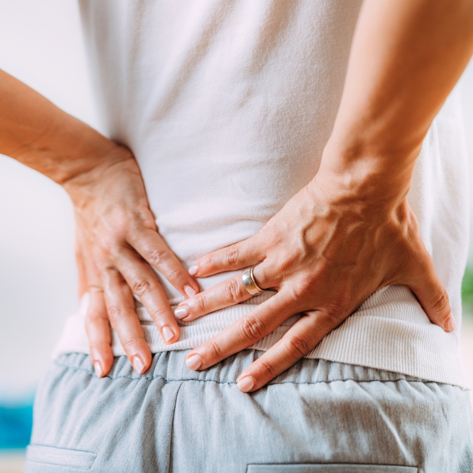Sciatica or sciatic nerve inflammation, lower back pain. Woman with sciatic nerve pain in her lower back.