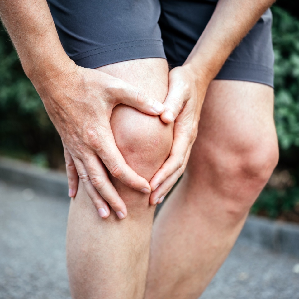 Meniscus tear in man athlete's knee, sports injuries concept
