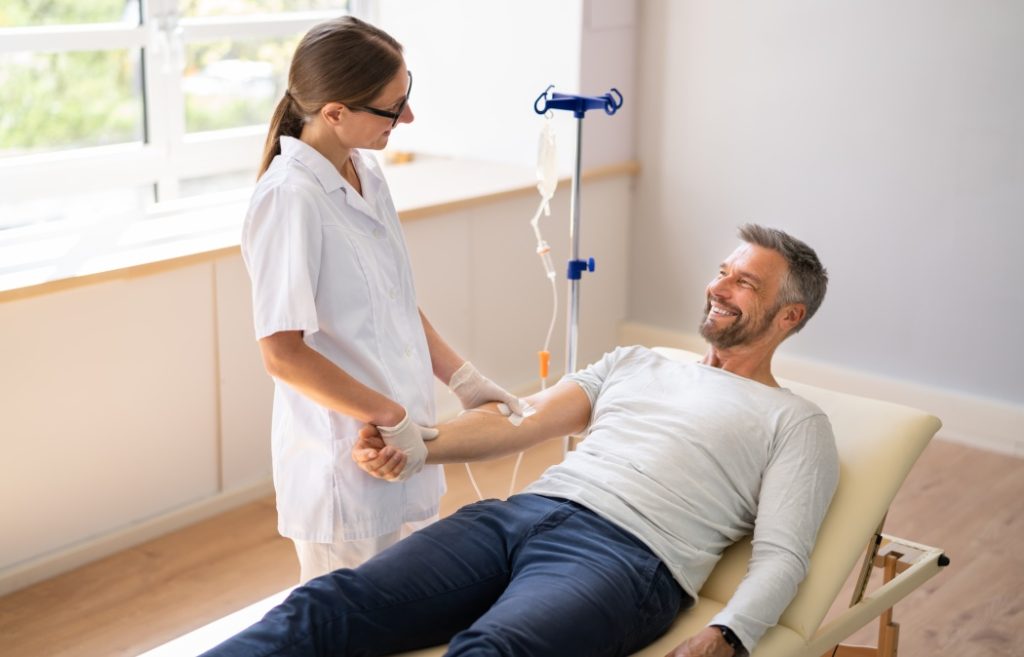 Vitamin Therapy IV Drip Infusion In Man Blood