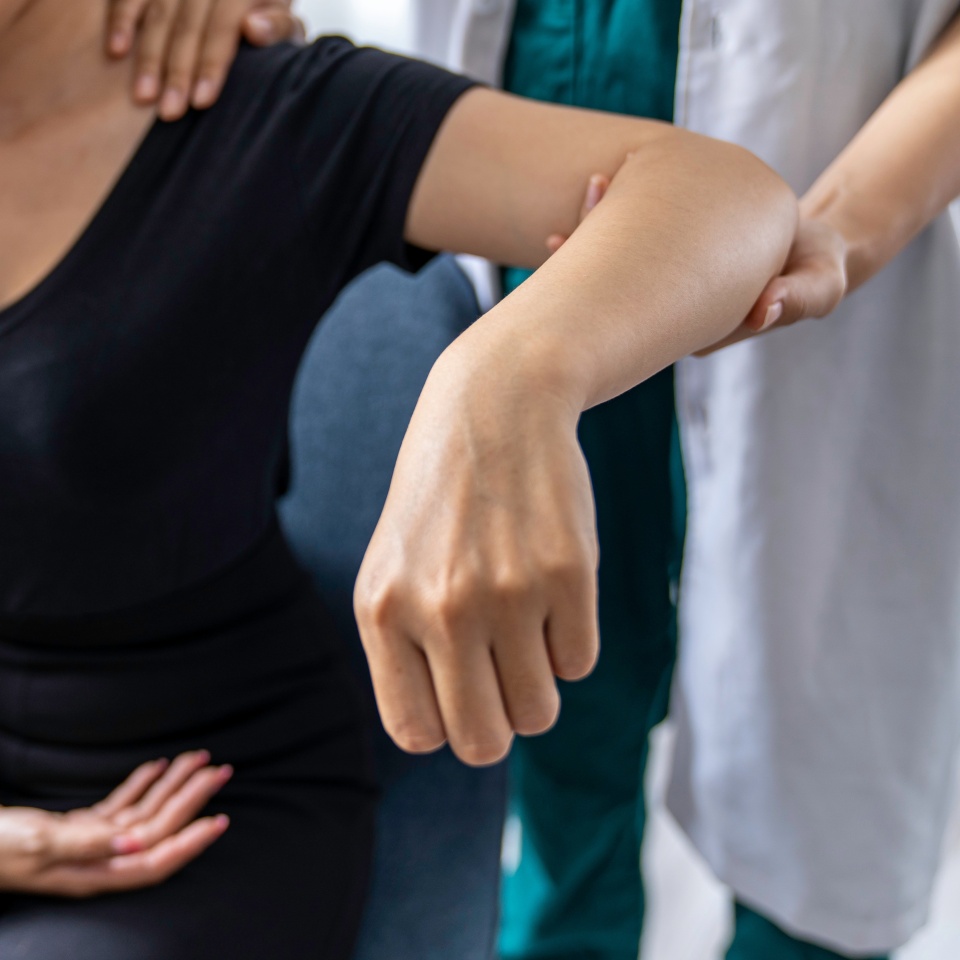 The doctor counsels the patient about pain in the muscles of the arms and elbows. office syndrome problem physical therapy diagnostic concept