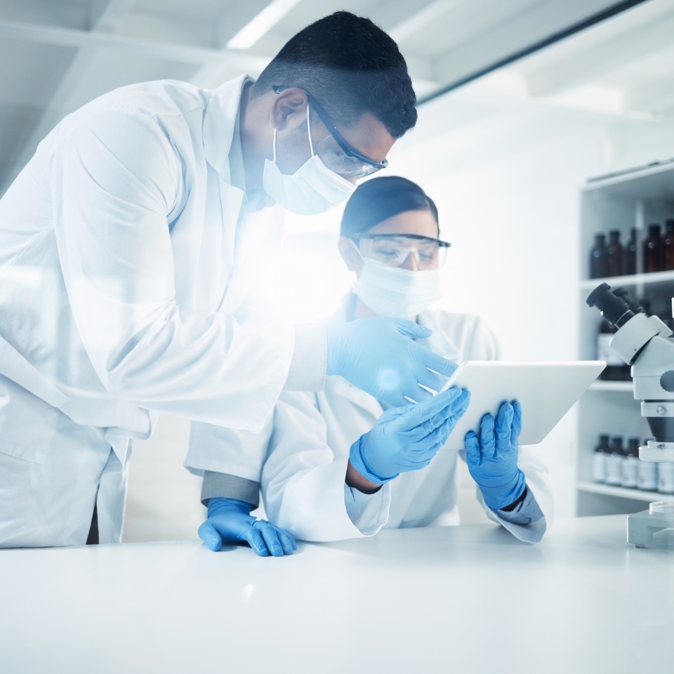 People, mask or scientists on tablet in lab for medical innovation, life expectancy or antiaging medicine. Teamwork, stem cell or biologists with chemistry research, results or science information