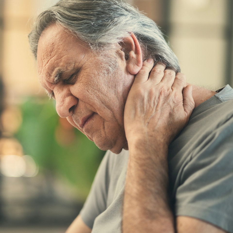Old man suffering from neck ache