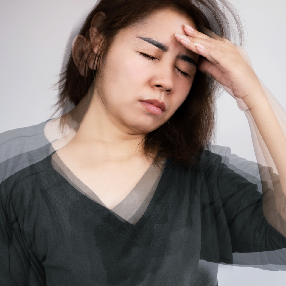 Asian woman suffering from Anemia feeling dizzy and vertigo , weakness and shortness of breath