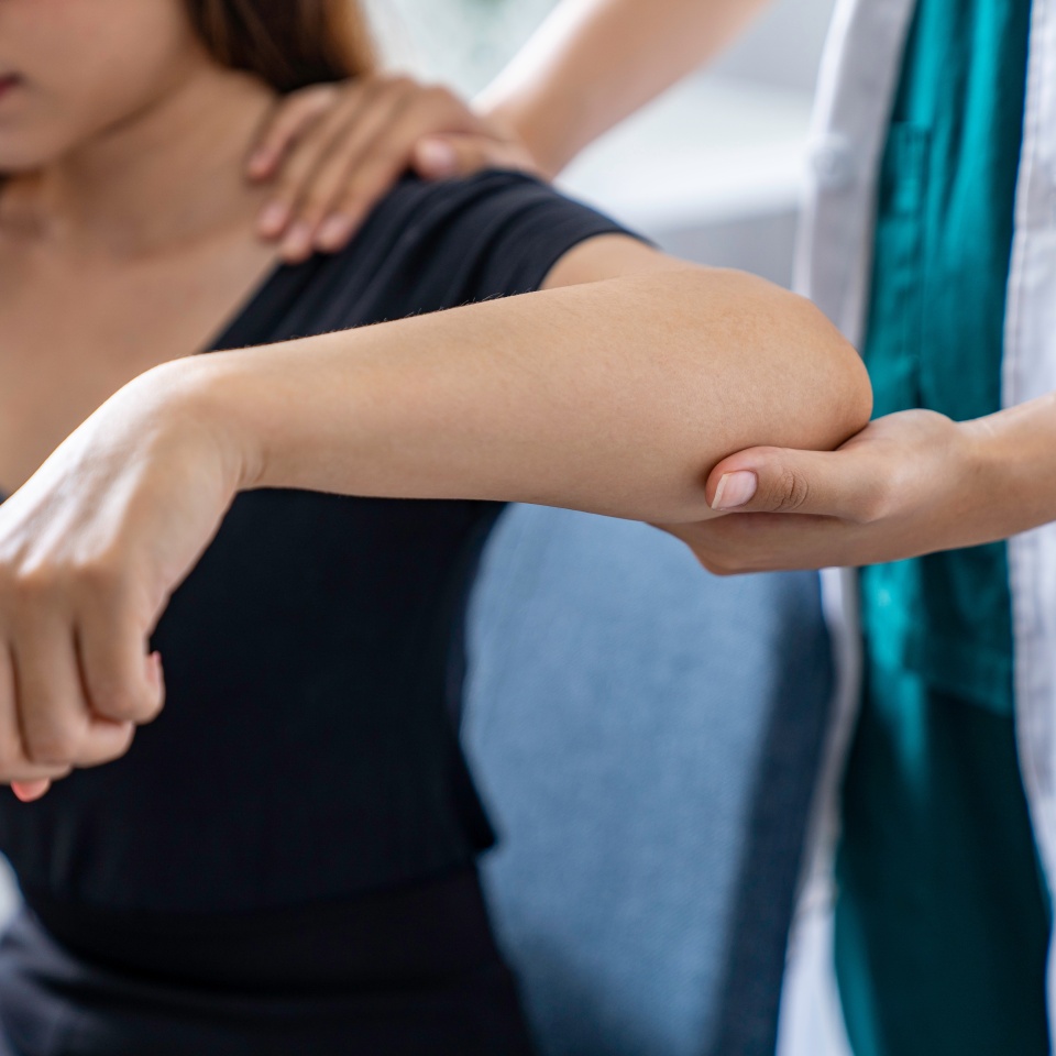 The doctor counsels the patient about pain in the muscles of the arms and elbows. office syndrome problem physical therapy diagnostic concept
