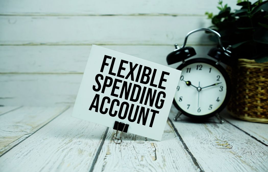 A board taht reads: Flexible Spending Accounts next to a ticking clock